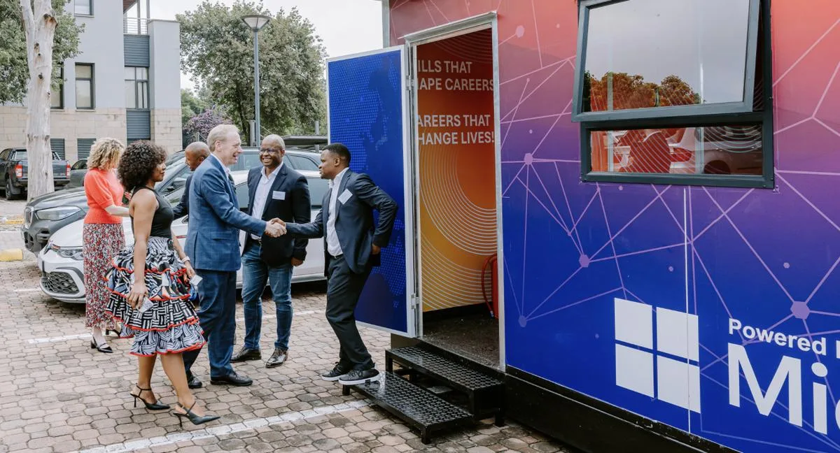 Microsoft\u2019s Brad Smith with Deviare co-founders at a mobile computer lab